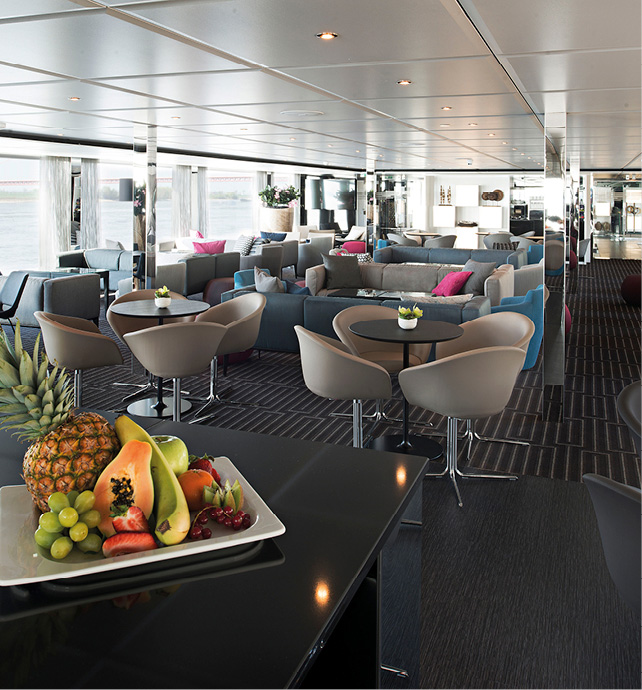 Tables in a bar area on board a luxury river cruise ship