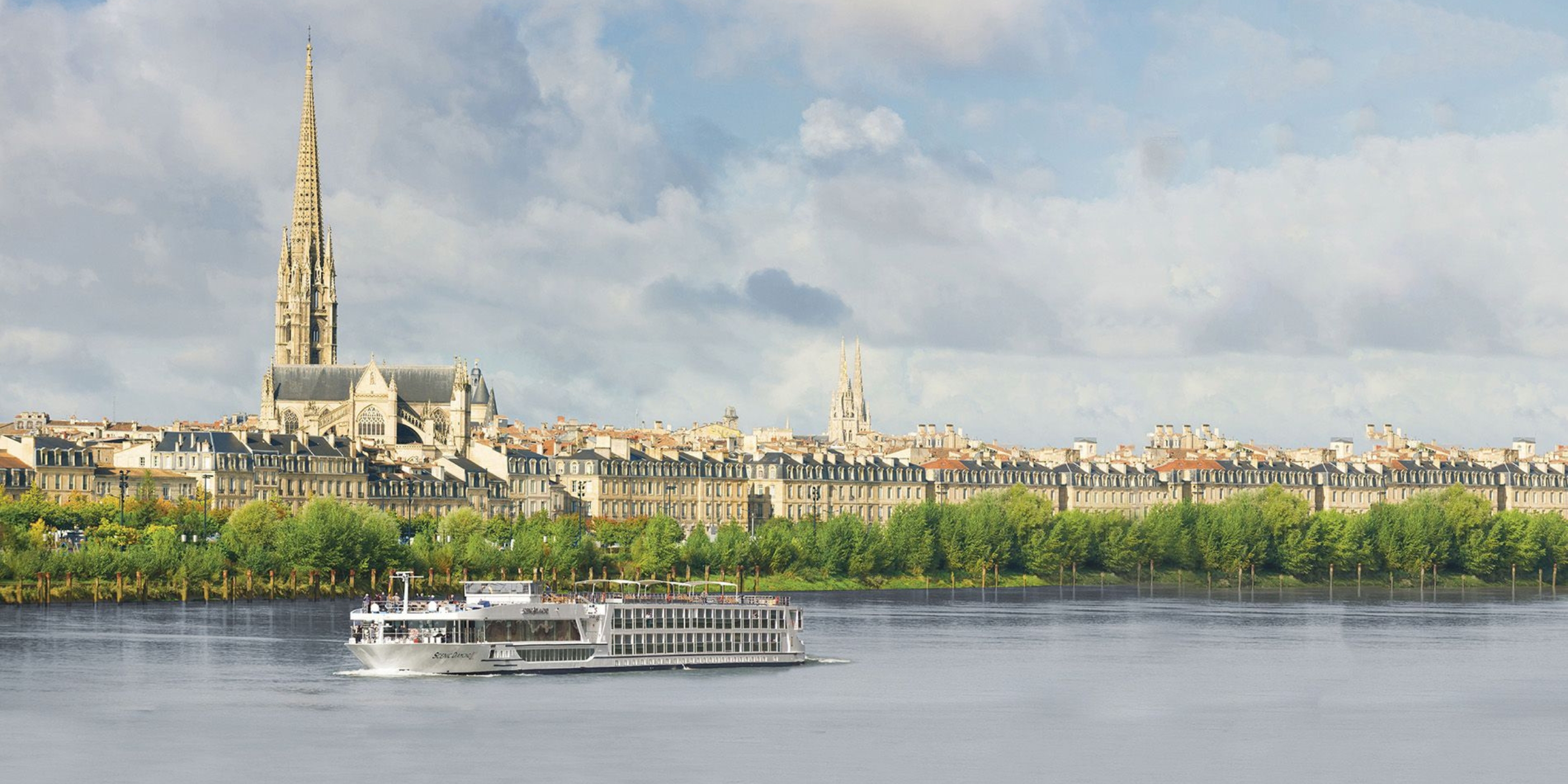 Luxury river cruise ship sailing down the river in Bordeaux
