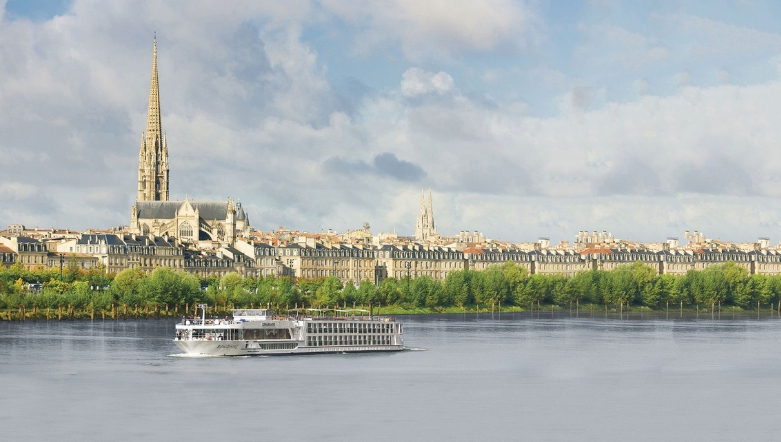 Luxury river cruise ship sailing down the river in Bordeaux
