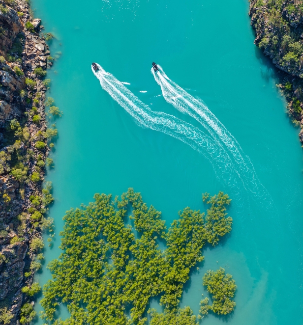 Two zodiac boats cruising through the waters of the Kimberleys in Australia