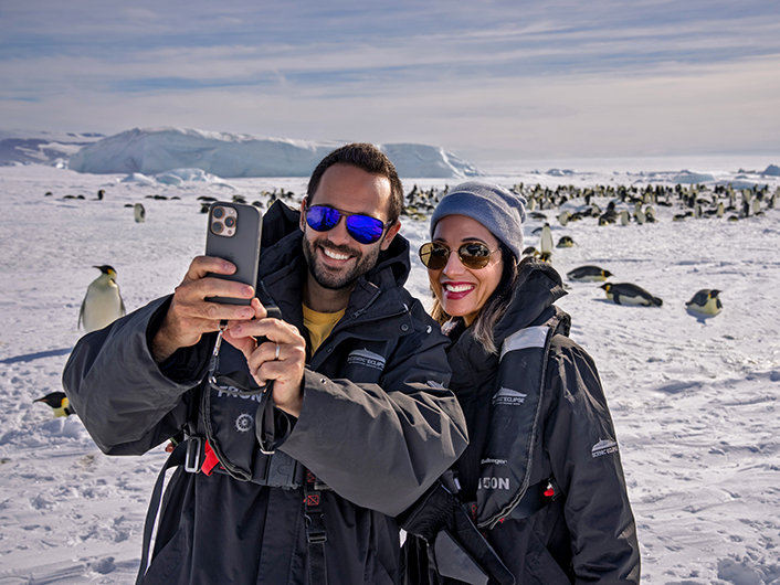 Couple taking selfie on Snow Hill Island, Antarctica